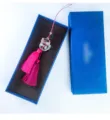 Detailed macro shot of crystal lucky cat car ornament with pink tassels in a blue box. - Lucky Cat Style (Gift Box Set)