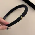 Elegante diadema acolchada negra con un delicado lazo dorado para mujer moda. - Negro