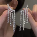 Exquisite silver tassel earrings with sparkling pear-cut cubic zirconia crystals - Teardrop Tiered Tassel Style (E4891) / Silver