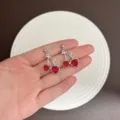 Sweet cherry stud earrings featuring red heart-shaped gems in a silver-tone finish - Heart Cherry Style (E4811) / Silver Red