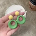 Vintage French style geometric green and yellow round drop earrings in a glossy finish - Light Green