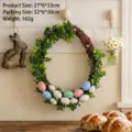 Festive Easter vine wreath featuring green boxwood leaves and spotted colorful eggs - Easter Egg Style