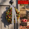 Decorative autumn pomegranate wreath with black and white striped ribbon hanging on a door - Large Pomegranate Wreath Style (H3-10)