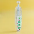 Primer plano de cinta decorativa tipo pulsador con dibujos de dinosaurios sobre fondo amarillo - 按动式修正带(ST-38L) / Patrón Verde