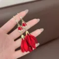 Close-up detail of French red petal tassel earrings with rhinestones and gold hooks - Floral Style (E1557) / Gold/Red