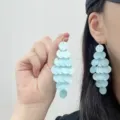 Elegant French style light blue layered disc tassel earrings with a pearlescent finish - Stud Earrings / Light Blue