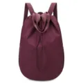 Lightweight burgundy nylon drawstring backpack with top handles and shoulder straps - One Size / Fuschia