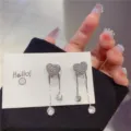 Elegant heart-shaped tassel earrings with sparkling rhinestones and delicate silver chains - Heart Tassel Style (E1768)