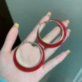 Large red enamel hoop earrings with sleek gold-tone frames for a bold fashion statement. - Round (E3639) / 5cm / Red
