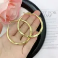 Large gold-toned twisted hoop earrings with elegant glossy metallic finish for women - Twisted Texture Hoop (E1900) / 5cm / Gold
