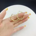 Elegant gold geometric hoop earrings with a faceted textured finish for women's style - Geometric Texture Hoop Style (E2459) / 3.3cm / Gold