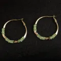 Luxury gold-tone twisted hoop earrings featuring vibrant green rhinestone embellishments - Twisted Rhinestone Hoop (E3870) / 3.8CM / Gold Green