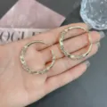 Fashionable twisted gold hoop earrings adorned with sparkling rhinestone details - Twisted Rhinestone Hoop (E3870) / 3.8CM / Light Burgundy Champagne