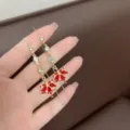 Dainty red maple leaf dangle earrings with sparkling rhinestones and long gold tassels - Rhinestone Ear Threader (E2607) / Red