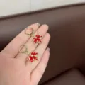 Exquisite gold-plated dangle earrings featuring vibrant red crystal maple leaf design - Gold Ear Buckle (E2607)