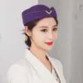 Elegant purple wool flight attendant hat with gold wing emblem for performance or uniform. - One Size (Fits 55-57cm Head Circumference) / Purple