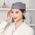 Élégant chapeau d'hôtesse de l'air en laine grise avec garniture en V dorée pour uniforme - Taille Unique (Convient au tour de tête 55-57cm) / Gris Chiné