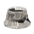 Stylish newspaper print graffiti bucket hat for sun protection and street fashion - Adjustable (56-60cm) / Beige
