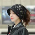 Stylish black winter beanie for women featuring a soft brim and gold constellation pattern - One Size (Stretchy) / Black (Constellation Print)