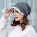 Elegant grey knit beanie hat with brim for women, soft thermal winter fashion accessory. - One Size (Stretchy) / Two-Tone Grey