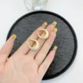 Vintage gold-tone U-shaped hoop earrings with cream enamel finish for elegant look - U-Shaped Ear Buckle / Gold White