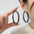 Classic oversized brown leather-wrapped hoop earrings with a geometric design style - Khaki