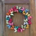 Close-up detail of a vibrant multi-colored artificial butterfly wreath for Easter decor - Style B / 30cm Size