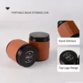 Portable small coffee bean storage canister with protective brown hand-stitched leather sleeve - S