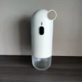 Portable white electric coffee grinder with ceramic core and clear base - White