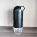 Portable mini electric coffee grinder in matte black finish with transparent cup - Black