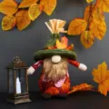 Handcrafted autumn harvest festival gnome with autumn leaf patterns and green felt hat - Green Hat Beard