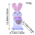 Peluche de conejo blanco luminoso con decoración de huevo de Pascua mostrando medidas y peso - Estilo de huevo de sujeción / 32x13x13cm