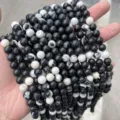 Close-up of natural black and white zebra jasper round loose beads for DIY jewelry - 90 Pieces/Pack (4mm) / Natural Black and White Zebra Stone