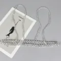 Detailed view of a silver beaded body chain harness accessory for dresses and shirts - Fine Silver