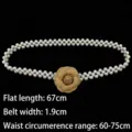 Elegant French-style pearl elastic waist belt featuring a brown camellia flower - Earthy Yellow