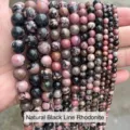 Macro view of natural rhodonite beads showing unique black and pink patterns in various sizes - 10mm (Approx 37 Beads) / Natural Rhodonite
