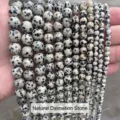 Close-up view of natural Dalmatian Jasper loose beads in various sizes for DIY jewelry - 4mm (Approx 90pcs) / Natural Dalmatian Stone