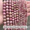 Close-up of various sizes of natural pink redwood vein stone beads for jewelry making - 4mm (Approx 90pcs) / 5A Natural Rhodonite