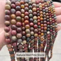 Close-up of multiple strands of natural red pinetree stone beads in various sizes - 4mm (Approx 90pcs) / Natural Red Turquoise
