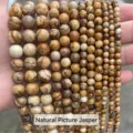 Close-up detail of natural picture jasper stone beads in various sizes for DIY jewelry - 4mm (Approx 90pcs) / Picture Jasper