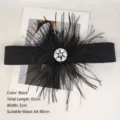 Elegant black elastic waist belt featuring a large feather flower and rhinestone cluster - Black