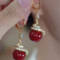 Elegant gold snake wrap earrings with glossy red beads and sparkling pavé stone detail - Spirit Snake Red Bead Style (E4530) / Red Gold