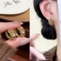 Detailed view of elegant gold huggie earrings set with sparkling champagne crystals - Full Rhinestone C-Hoop Style (E4504) / Gold