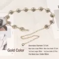 Elegante cintura a catena in metallo dorato con decorazioni a forma di fungo dettagliate - Oro