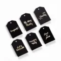 Set von sechs schwarzen Geschenkanhängern aus Papier mit edler Goldfolien-Schrift - Schwarze Geschenkanhänger (Glückwünsche/Prost) / 6 Stück
