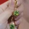 Elegant gold plated drop earrings featuring brilliant round green zircon stones. - Lever-back Round Style (E2524) / Gold Green Zirconia