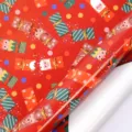 Rote Weihnachtsgeschenkpapierrolle mit festlichen Weihnachtsmann- und Rentier-Motiven - Weihnachtsserie - Bonbon-Spaß / 43cm*3m