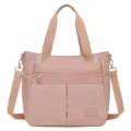 Minimalistische rosa Nylontasche mit großem Fassungsvermögen und verstellbarem Gurt - 8 / Lotusrosa