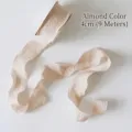 Detailed view of apricot ruffled bubble yarn ribbon 4cm wide for flower bouquet packaging - 9 Meters Long / Off White