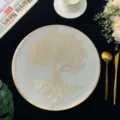 Close-up of elegant French style PVC placemat featuring a gold tree of life pattern design. - Style I (Tree of Life) / Gold